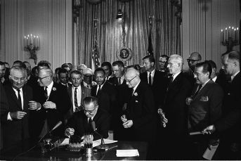 2014- 800px-Lyndon_Johnson_signing_Civil_Rights_Act,_July_2,_1964